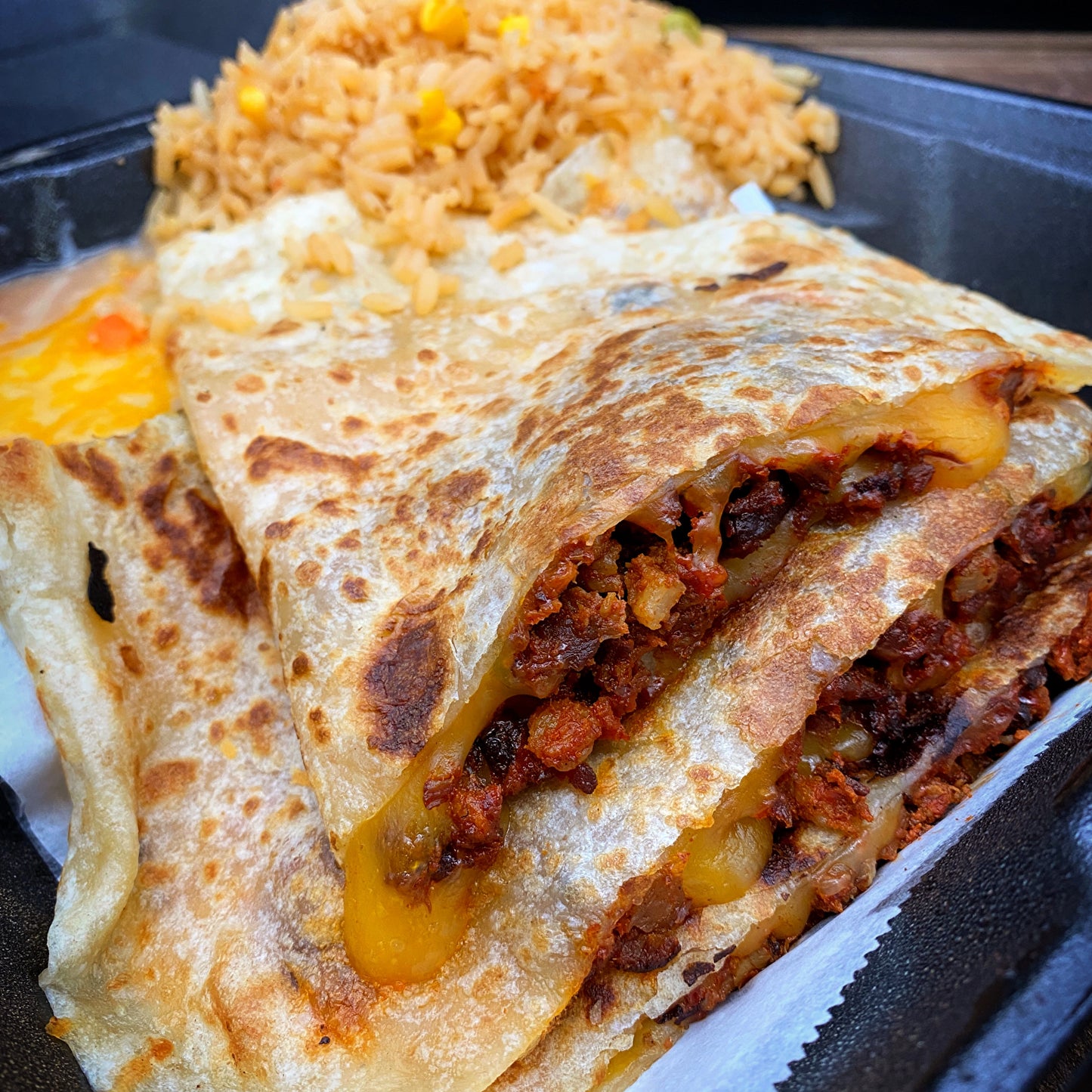 Carnivore Quesadilla with cheese, meat, rice, and beans.