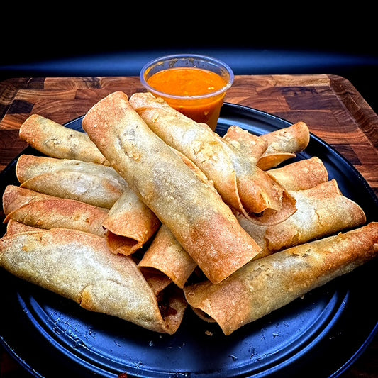 12 crispy beef tallow fried taquitos on a tray, beef and potato or potato filling
