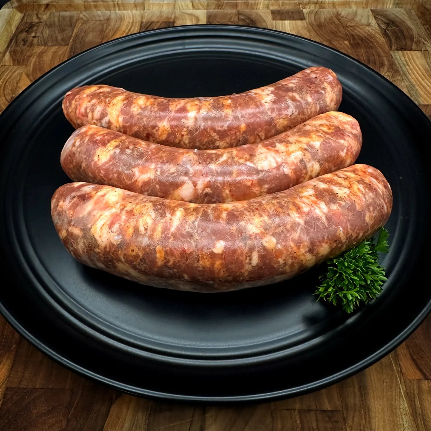 Image of Argentine Sausage (Chorizo Argentino), showcasing pork sausages seasoned with white wine, beer, and authentic Argentine spices.