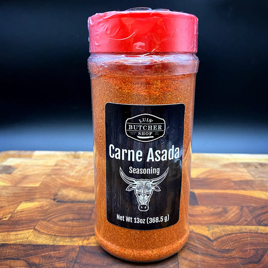 A jar of Luis' Butcher Shop signature Carne Asada seasoning, perfect for beef and pork, or as a marinade with citrus juice.