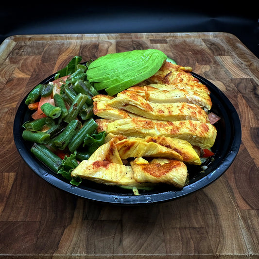 Chicken Keto Bowl with Chicken Breast, asparagus, bell pepper, cucumber, tomato, kale, and avocado.