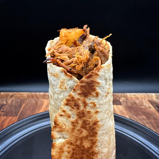 Express breakfast burrito with seasoned shredded pork, ground beef, egg and potatoes wrapped in a flour tortilla