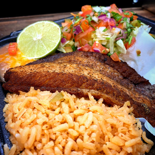 Pan Fried Fish Filet with salt, pepper, and garlic, served with chips, rice, and beans.