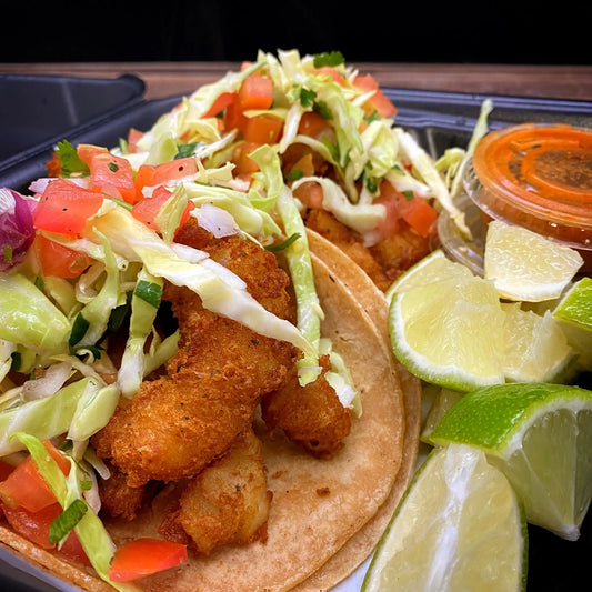 Fish Taco with battered and fried Swahi filet, cabbage, and pico de gallo in a soft tortilla.