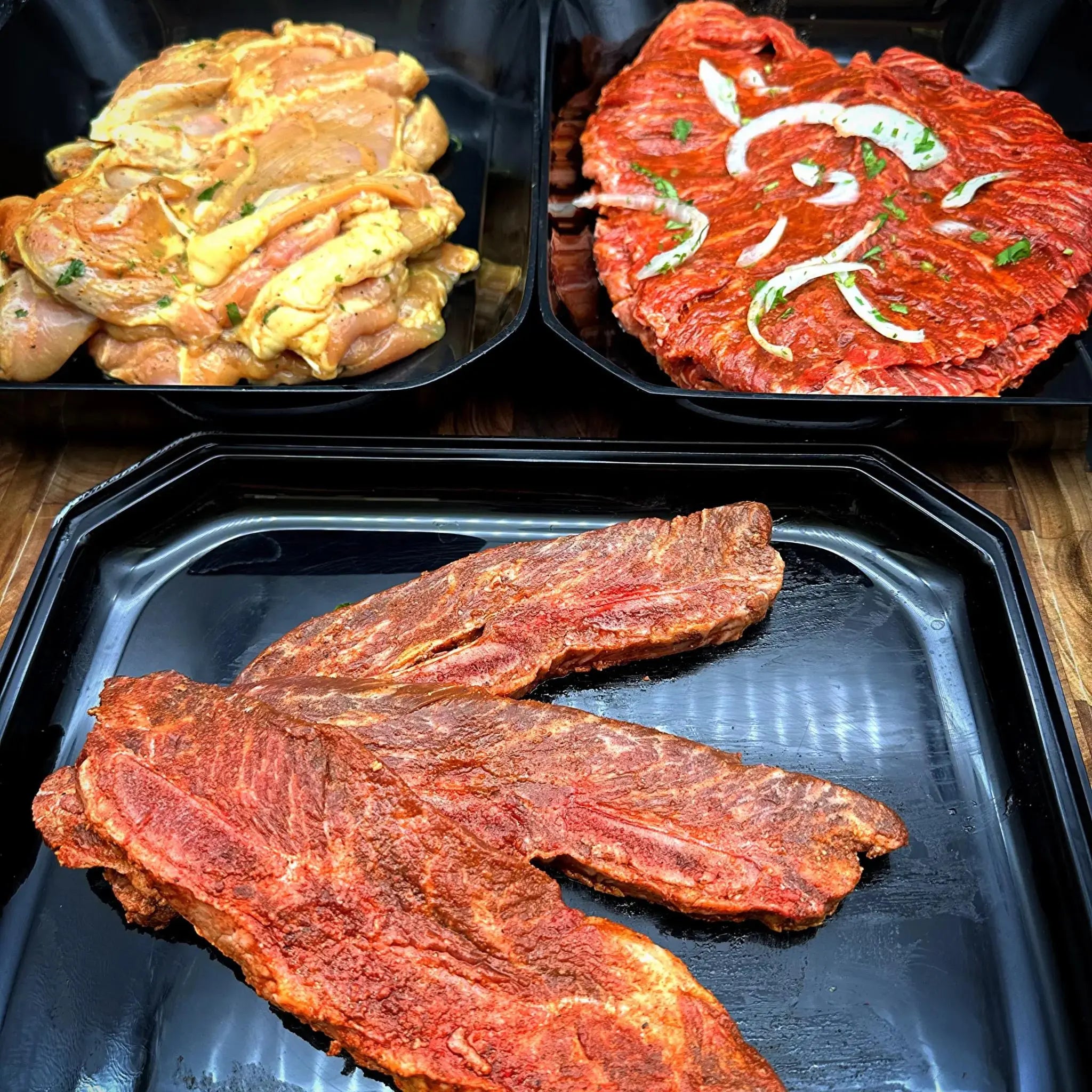 Family Pack 1 - Includes 2 lbs of Carne Asada, 2 lbs of Baja Chicken, and 1 lb of Marinated Short Ribs, serving 5-7 people.