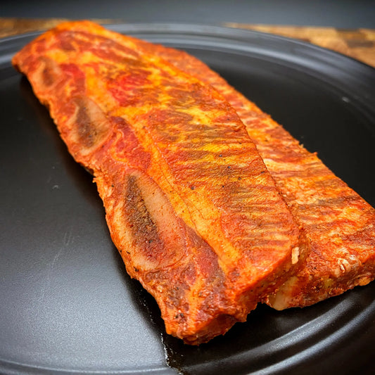 Image of Marinated Prime Beef Short Ribs, showcasing thin-cut USDA Prime short ribs marinated in a citrus asada blend, ready for grilling or pan frying.