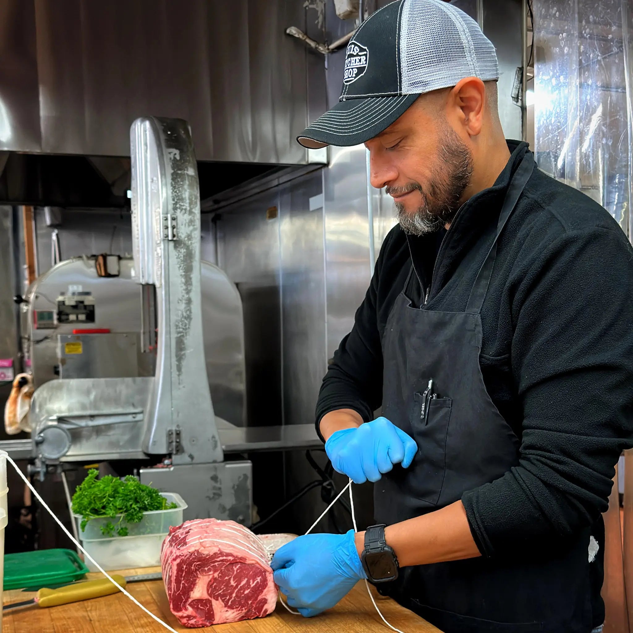 Butcher preparing meat