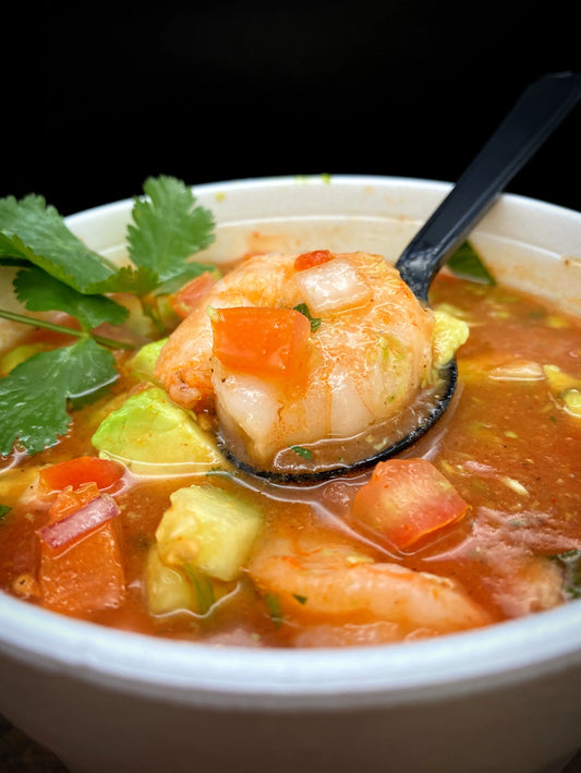 Shrimp Cocktail with tomato juice, cucumber, cilantro, tomato, avocado, and tortilla chips.