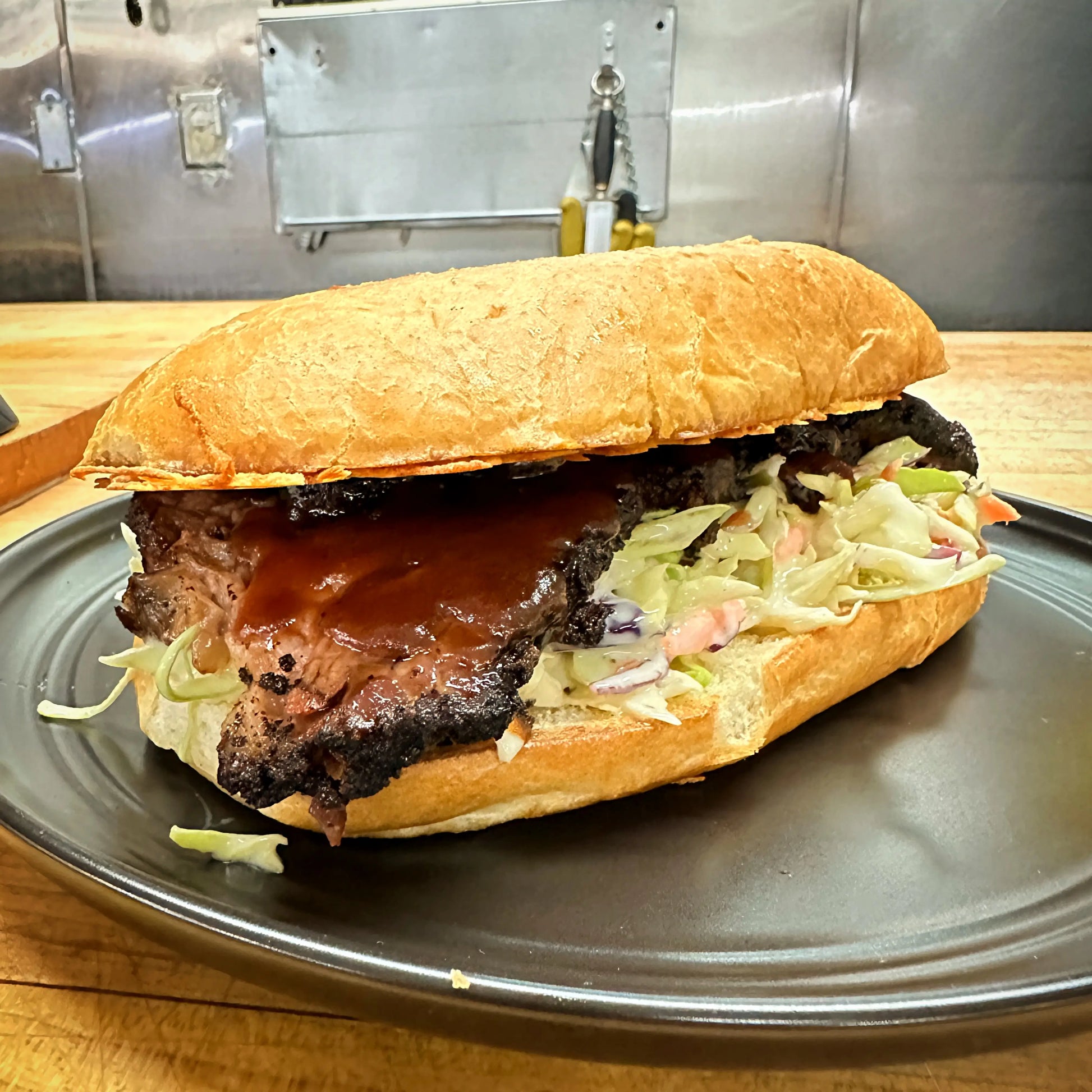 Regular Brisket Sandwich with hickory smoked brisket and coleslaw.