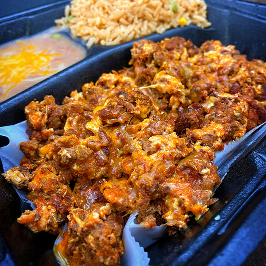 Chorizo and Eggs Plate with tortillas, rice, and beans.