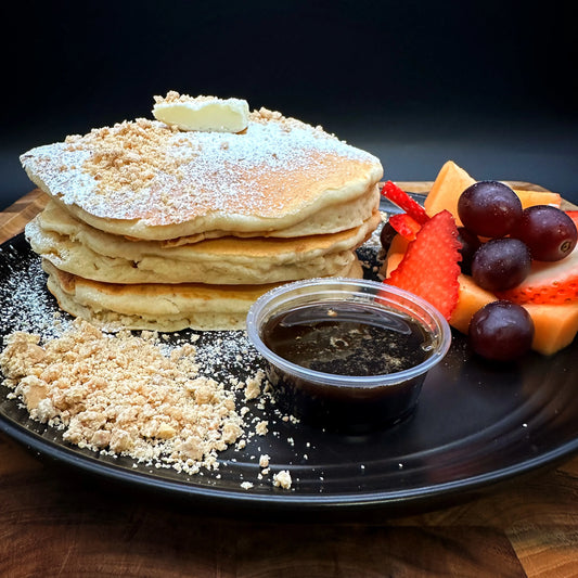 Mazapan Pancakes with coffee syrup, butter, and seasonal fruit.