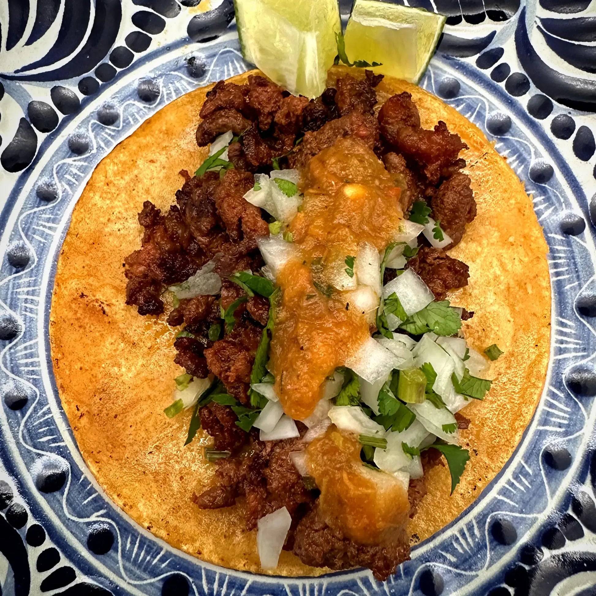 Tacos with your choice of meat, onions, cilantro, and limes.